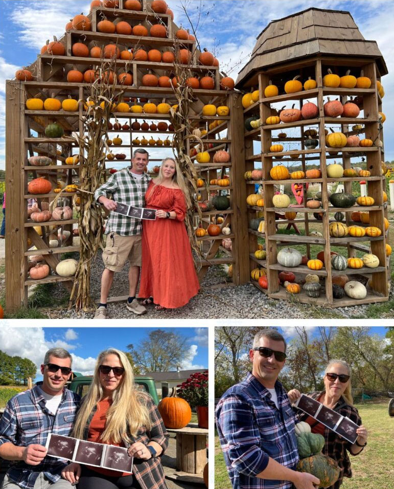 A couple holds ultrasound photos at a pumpkin patch, surrounded by fall decorations and colorful pumpkins, celebrating their growing family.